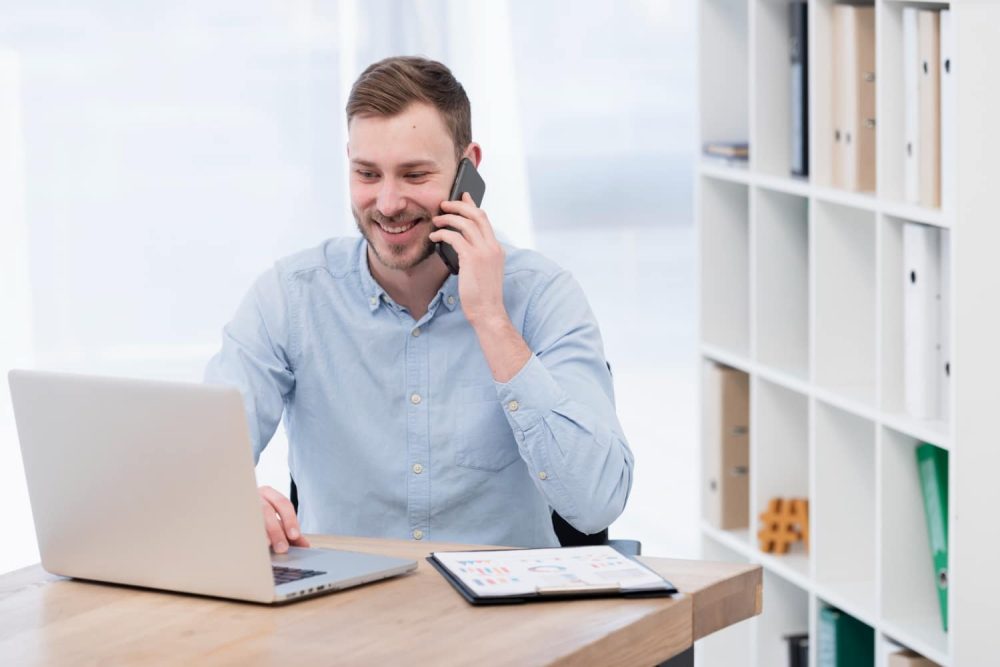 smiley-man-working-laptop